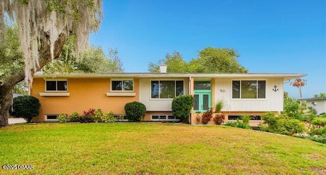 21 Pine Valley Cir, Ormond Beach, FL 32174 - raised ranch featuring a front lawn