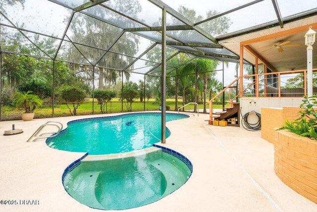 21 Pine Valley Cir, Ormond Beach, FL 32174 - view of pool with a patio area, stairs, a pool with connected hot tub, and glass enclosure