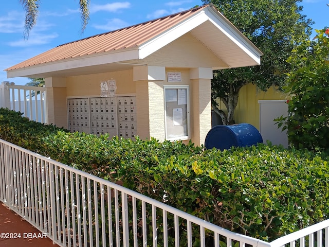 view of home's exterior with a mail area