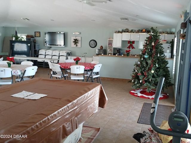 tiled dining room with ceiling fan