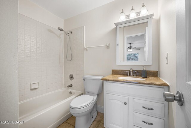 full bath featuring  shower combination, vanity, toilet, and tile patterned floors