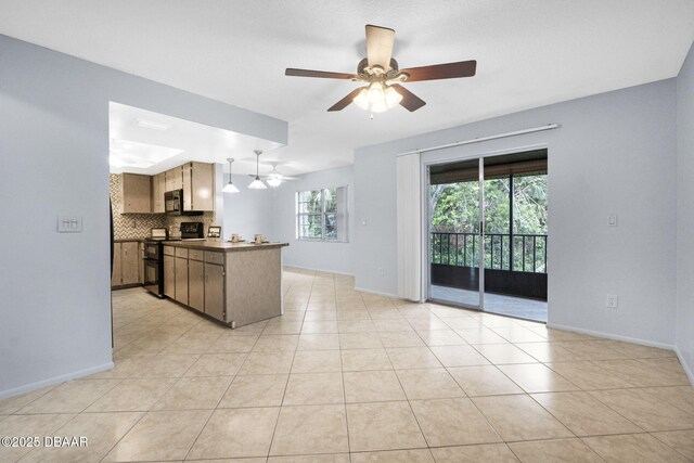 kitchen with dark countertops, decorative backsplash, a ceiling fan, a peninsula, and black appliances