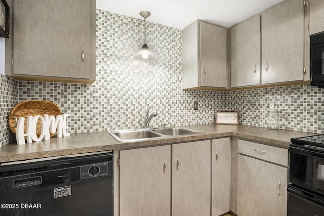 kitchen featuring black appliances, dark countertops, a sink, and decorative backsplash