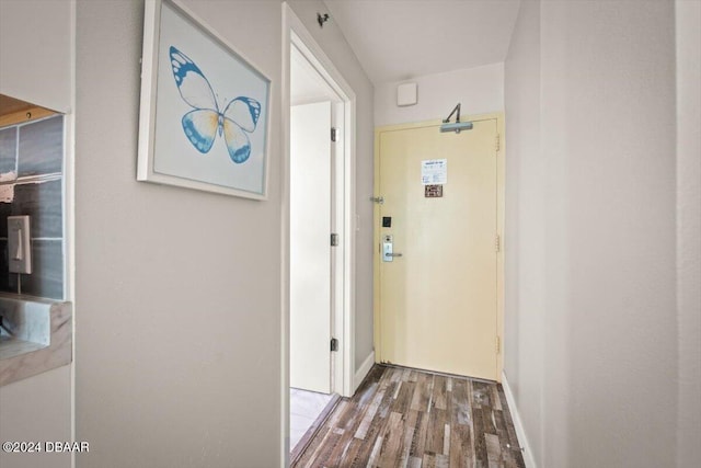 corridor with wood-type flooring