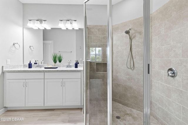 586 Lost Shaker Way, Daytona Beach, FL 32124 - full bathroom featuring a shower stall, double vanity, and wood finished floors