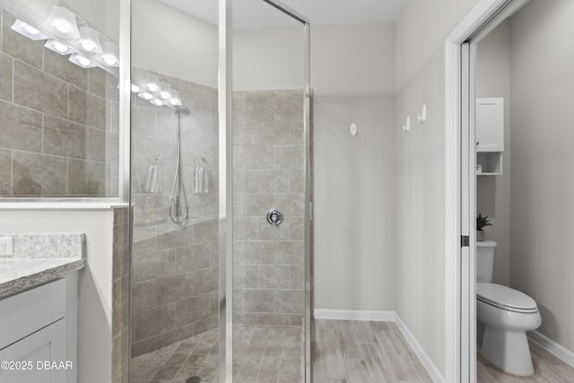 586 Lost Shaker Way, Daytona Beach, FL 32124 - full bath featuring toilet, vanity, a stall shower, and wood finished floors