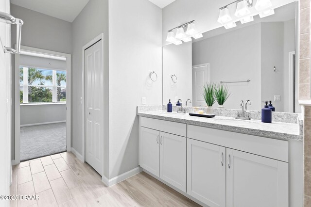 586 Lost Shaker Way, Daytona Beach, FL 32124 - full bathroom featuring double vanity and baseboards