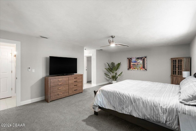 bedroom with light colored carpet and ceiling fan