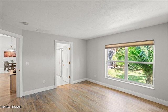 unfurnished room featuring light wood-type flooring