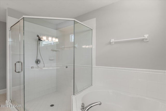 bathroom with independent shower and bath