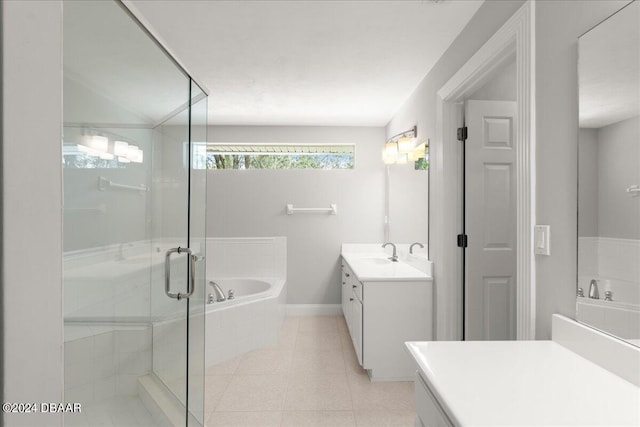 bathroom featuring vanity, tile patterned flooring, and separate shower and tub