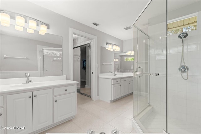 bathroom featuring vanity and an enclosed shower