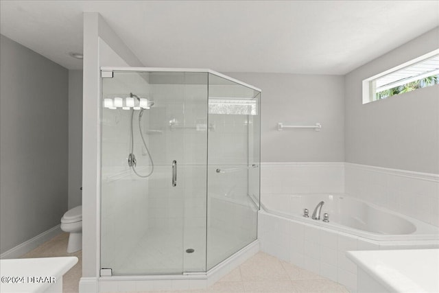 bathroom with separate shower and tub and toilet