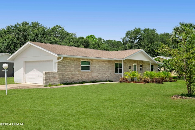 ranch-style home featuring a front lawn and a garage