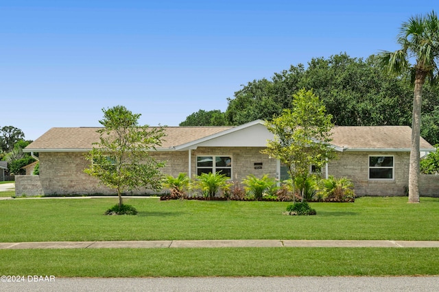 ranch-style house with a front yard