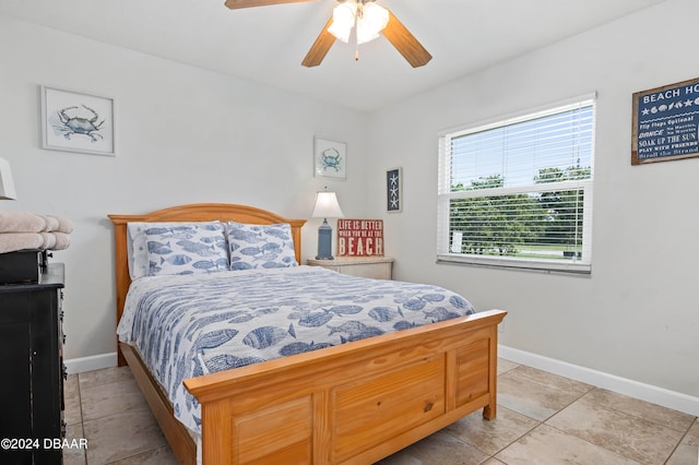 bedroom featuring ceiling fan and light tile patterned floors