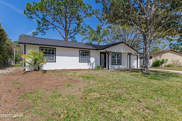 single story home featuring a garage and a front yard