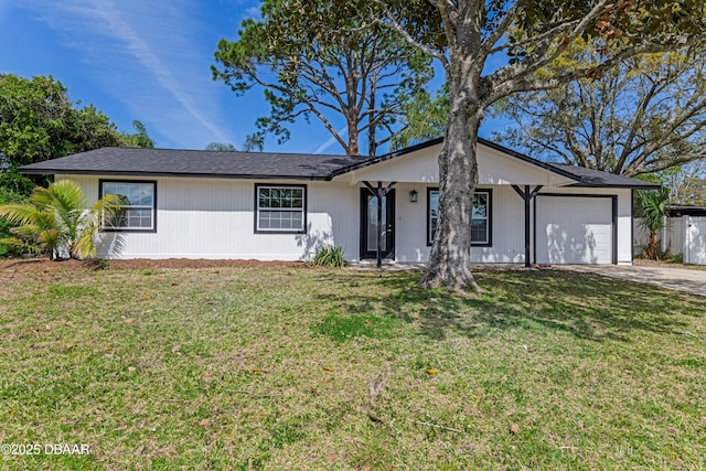 single story home featuring a garage, fence, a front lawn, and concrete driveway