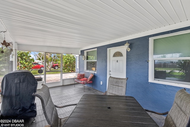 wooden terrace featuring covered porch