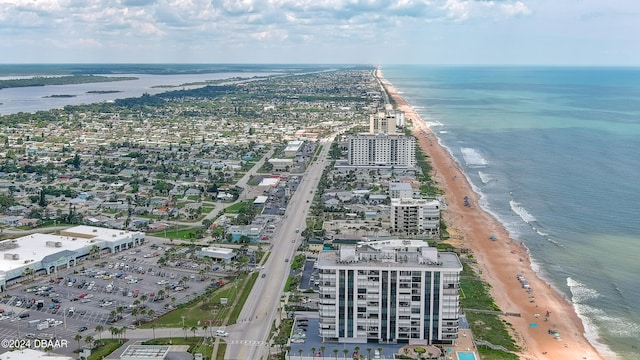 birds eye view of property with a view of the beach and a water view