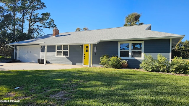 single story home with a front yard and a garage