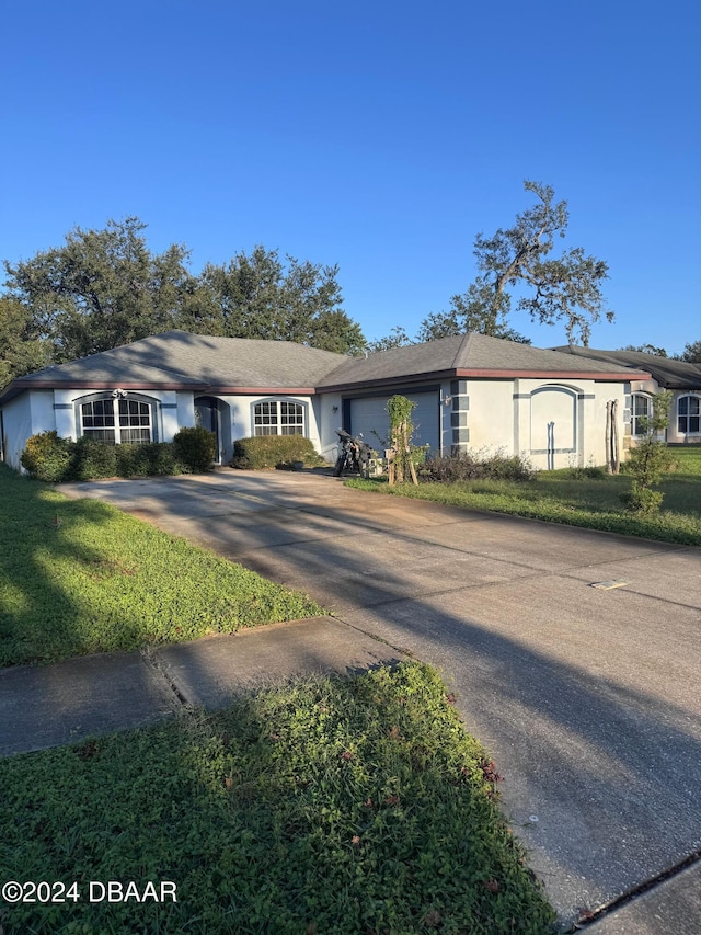 single story home featuring a garage