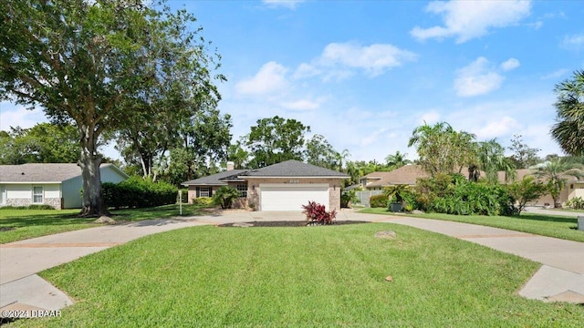 ranch-style house featuring a garage and a front lawn