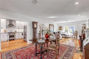 dining space featuring light hardwood / wood-style floors