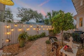 view of patio terrace at dusk