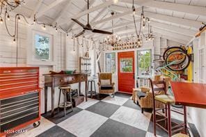 interior space with vaulted ceiling with beams