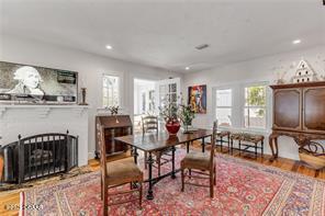 dining room featuring hardwood / wood-style floors and a healthy amount of sunlight