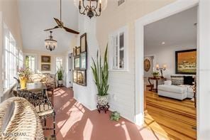 hallway featuring an inviting chandelier