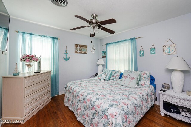 bedroom featuring dark hardwood / wood-style floors and ceiling fan