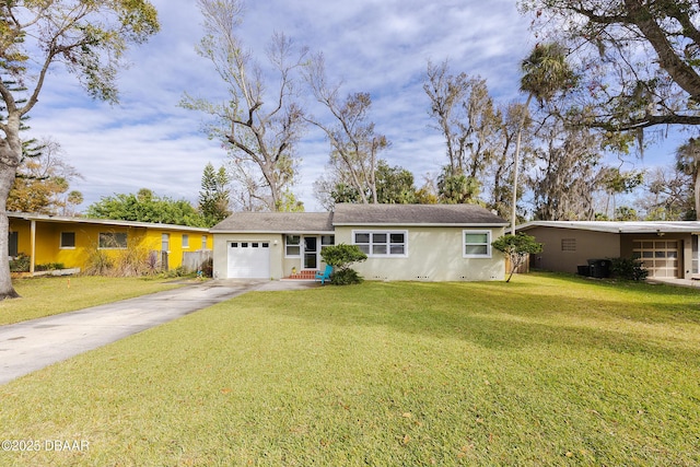 ranch-style house with a garage and a front yard