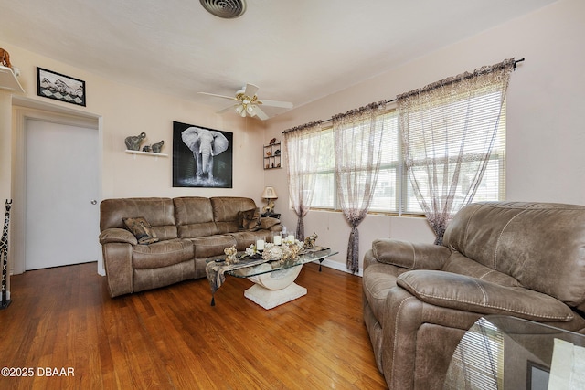 living room with hardwood / wood-style flooring and ceiling fan