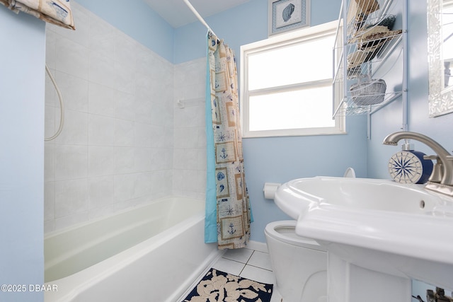 full bathroom featuring tile patterned flooring, sink, shower / tub combo, and toilet