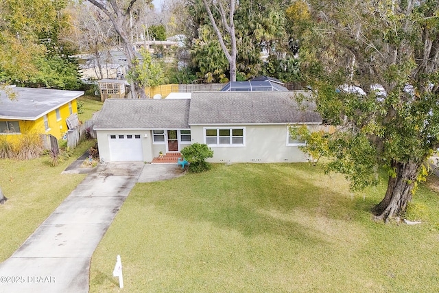 view of front of home featuring a garage and a front lawn