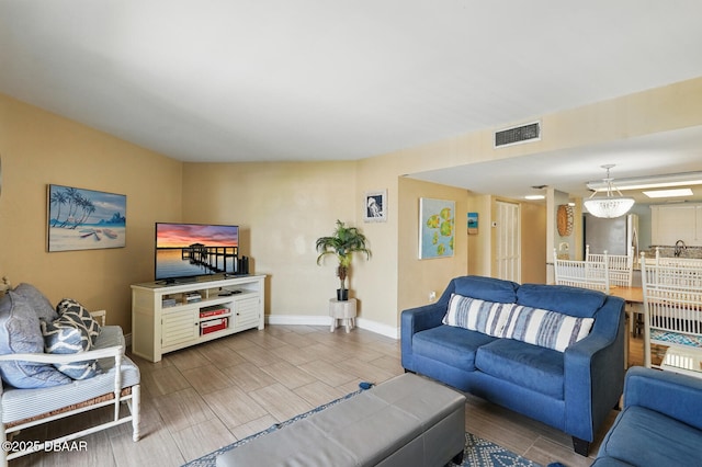 2626 S Atlantic Ave Unit 505, Daytona Beach, FL 32118 - living room with baseboards and wood tiled floors