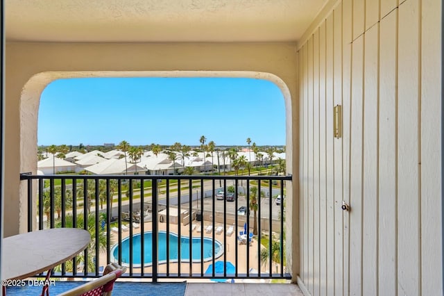 2626 S Atlantic Ave Unit 505, Daytona Beach, FL 32118 - balcony featuring view of pool area and a residential view