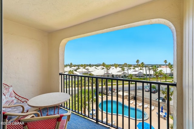2626 S Atlantic Ave Unit 505, Daytona Beach, FL 32118 - balcony with view of pool area and a residential view