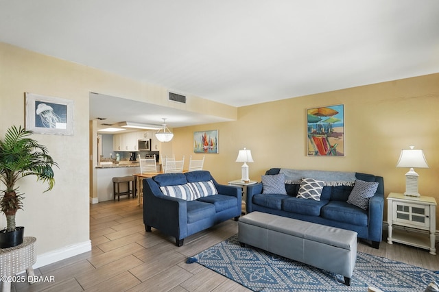 2626 S Atlantic Ave Unit 505, Daytona Beach, FL 32118 - living area with wood finished floors and baseboards