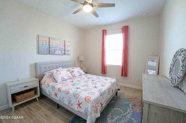 bedroom featuring hardwood / wood-style floors and ceiling fan