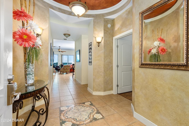 1925 S Atlantic Ave Unit 205, Daytona Beach Shores, FL 32118 - hallway with light tile patterned flooring, baseboards, and crown molding
