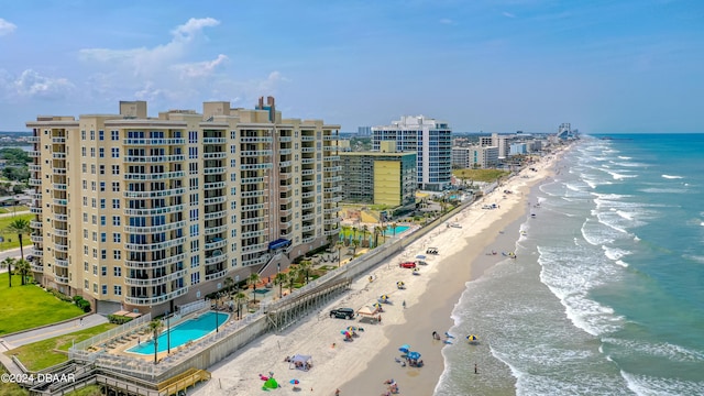 aerial view with a water view and a beach view