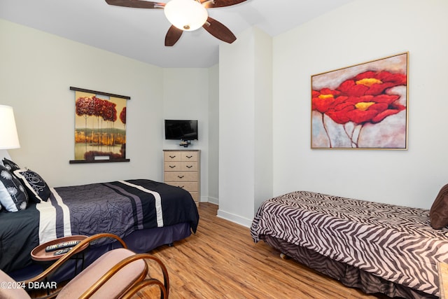 1925 S Atlantic Ave Unit 205, Daytona Beach Shores, FL 32118 - bedroom with wood finished floors, baseboards, and ceiling fan