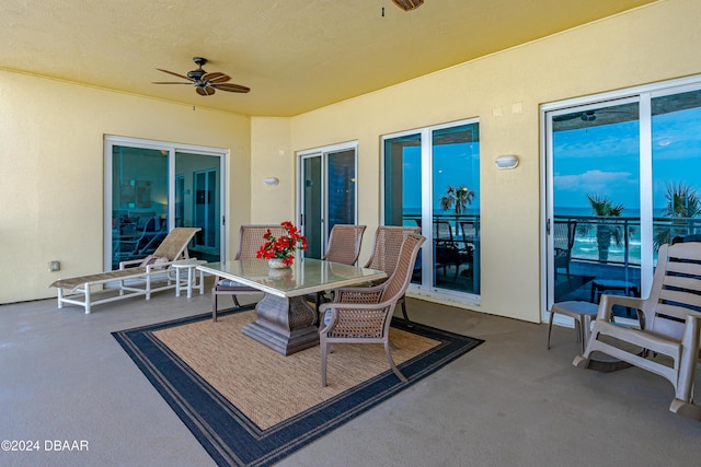 1925 S Atlantic Ave Unit 205, Daytona Beach Shores, FL 32118 - view of patio / terrace with a ceiling fan and outdoor dining space