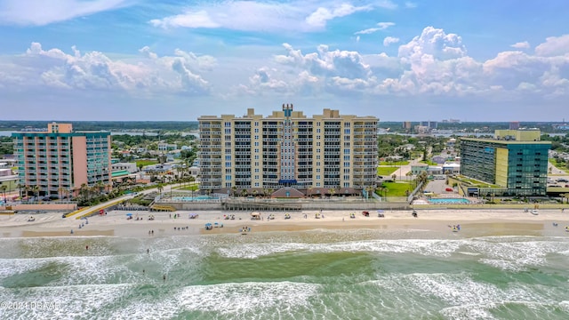 birds eye view of property with a view of the beach and a water view