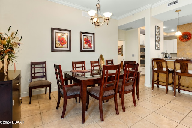 tiled dining space with an inviting chandelier and ornamental molding