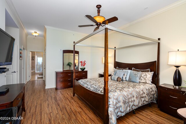 bedroom featuring hardwood / wood-style flooring, ceiling fan, and crown molding