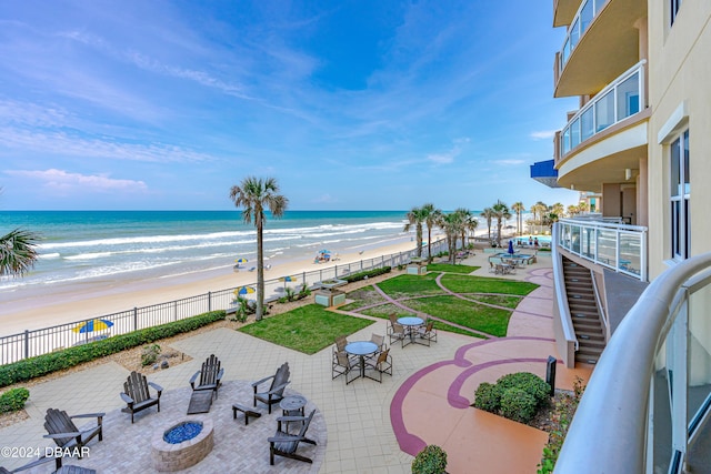 1925 S Atlantic Ave Unit 205, Daytona Beach Shores, FL 32118 - water view with an outdoor fire pit and nearby beach